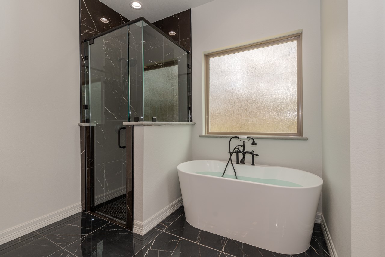 7820 Tolivar Road Beaumont, TX 77713 - Photo 35 of 47 a bathroom with a bathtub and shower