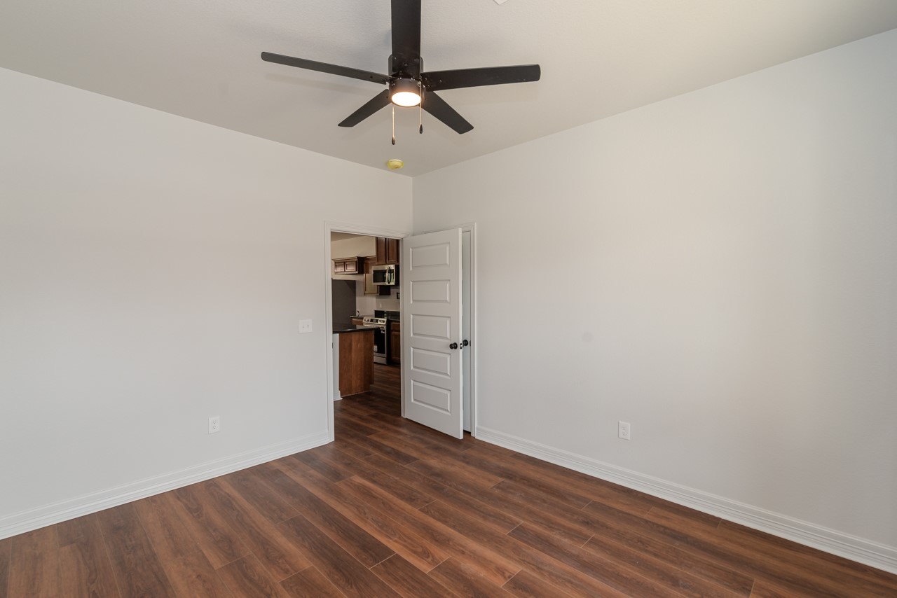 7820 Tolivar Road Beaumont, TX 77713 - Photo 42 of 47 a view of empty room with wooden floor