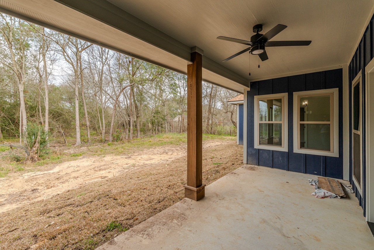 7820 Tolivar Road Beaumont, TX 77713 - Photo 45 of 47 a view of a livingroom with a ceiling fan and a large window