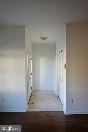 an entryway view with wooden floor