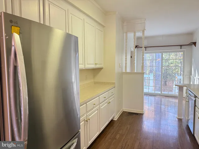 a kitchen with stainless steel appliances a refrigerator and a stove