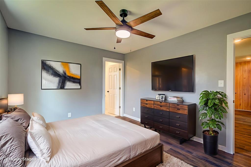 520 North 1st Street Point, TX 75472 - Photo 22 of 34 a bedroom with a bed and a flat screen tv