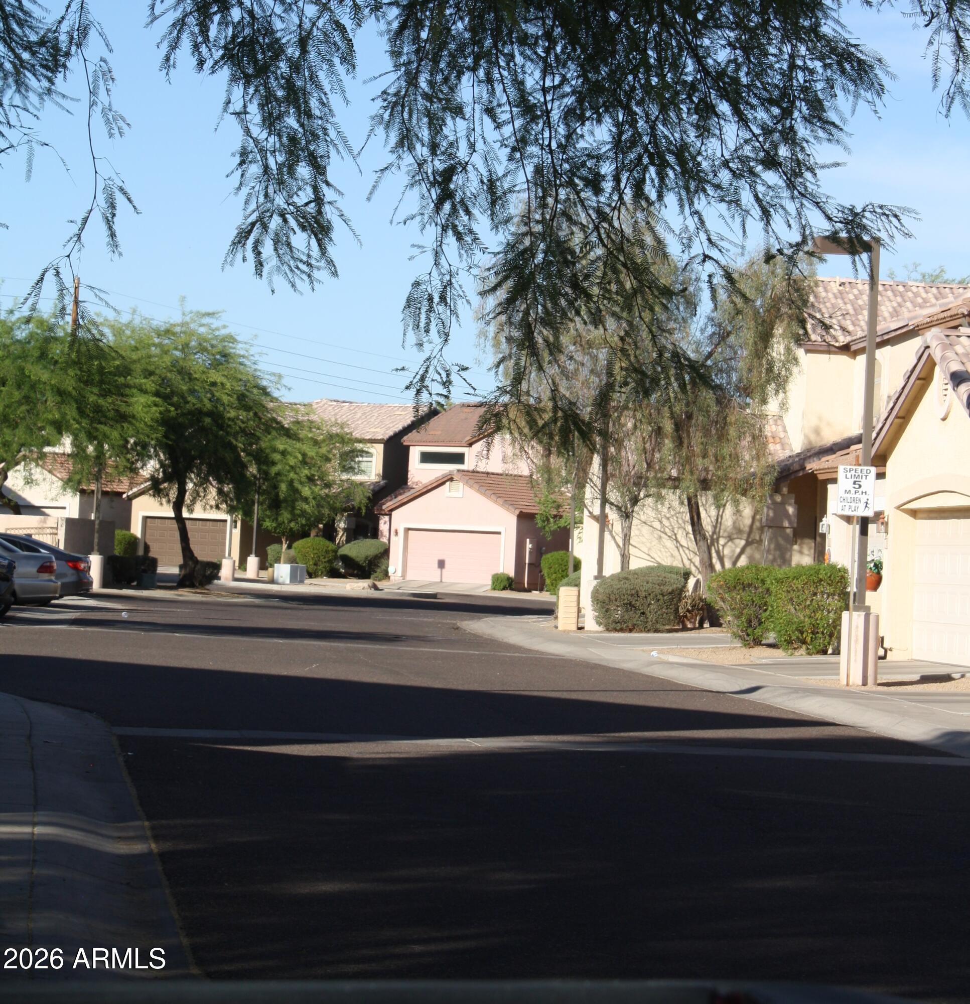 10225 West Camelback Road, Unit 19 Phoenix, AZ 85037 - Photo 50 of 51 a view of a building and trees