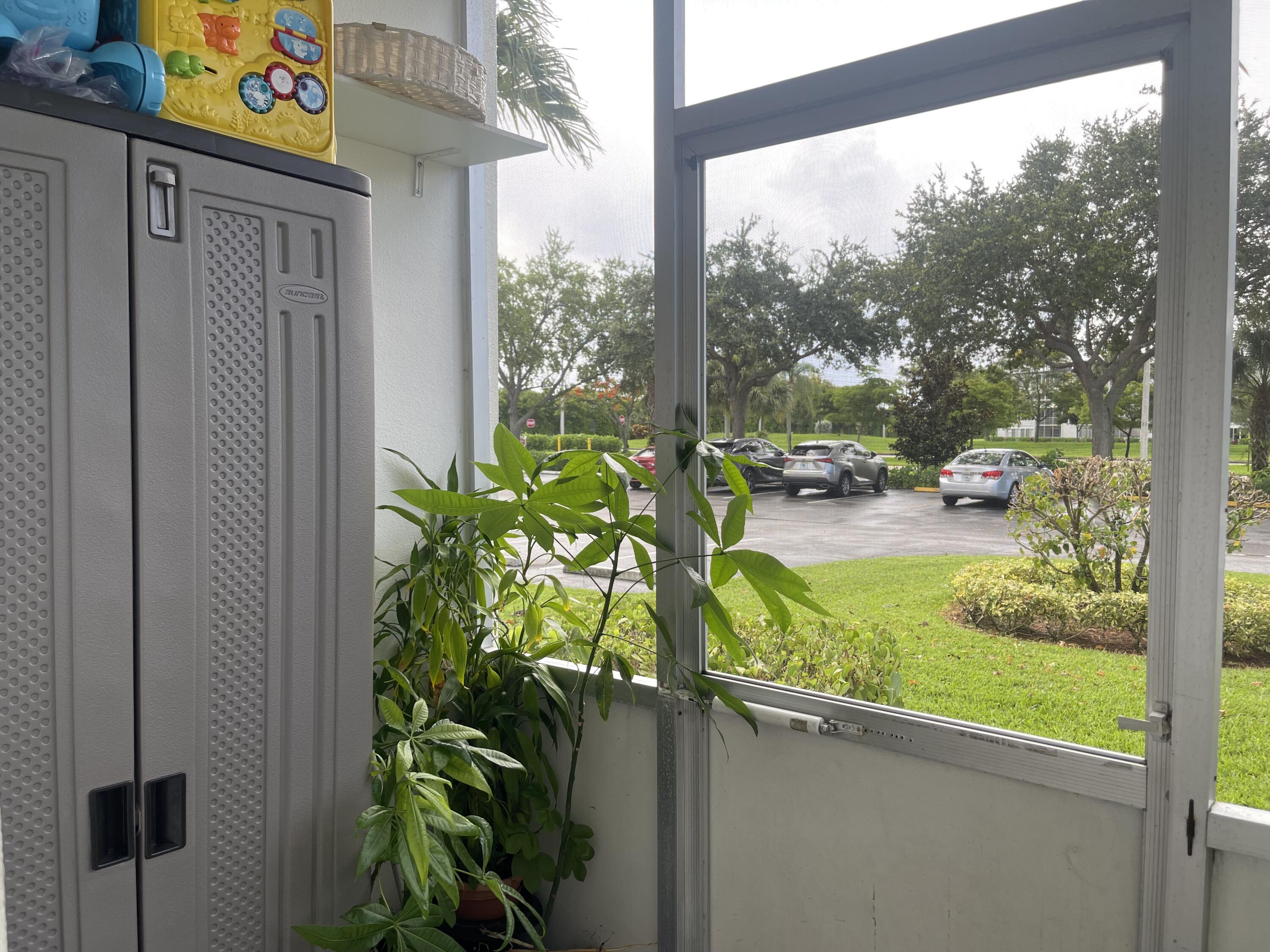 49 Mansfield B Boca Raton, FL 33434 - Photo 15 of 31 a view of yard from a window