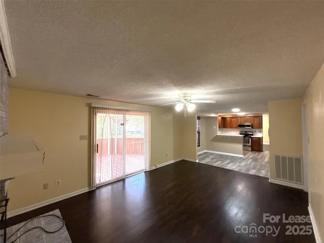 a view of a livingroom with wooden floor