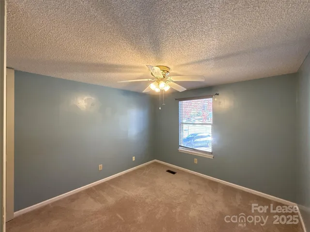 an empty room that has a window