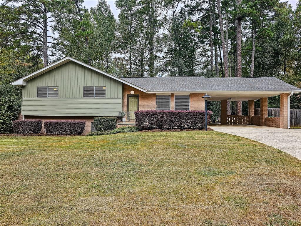 2896 Harcourt Drive Decatur, GA 30033 - Photo 1 of 1 a front view of a house with a garden