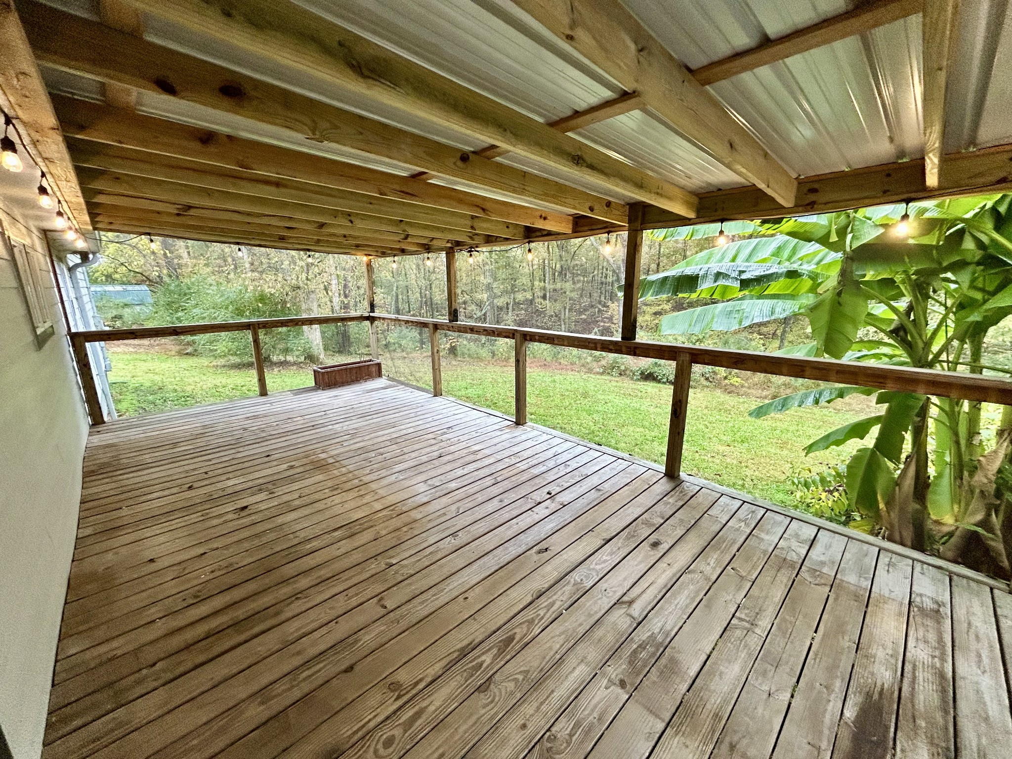 10209 New Hope Road Bon Aqua, TN 37025 - Photo 19 of 27 a view of porch with wooden floor