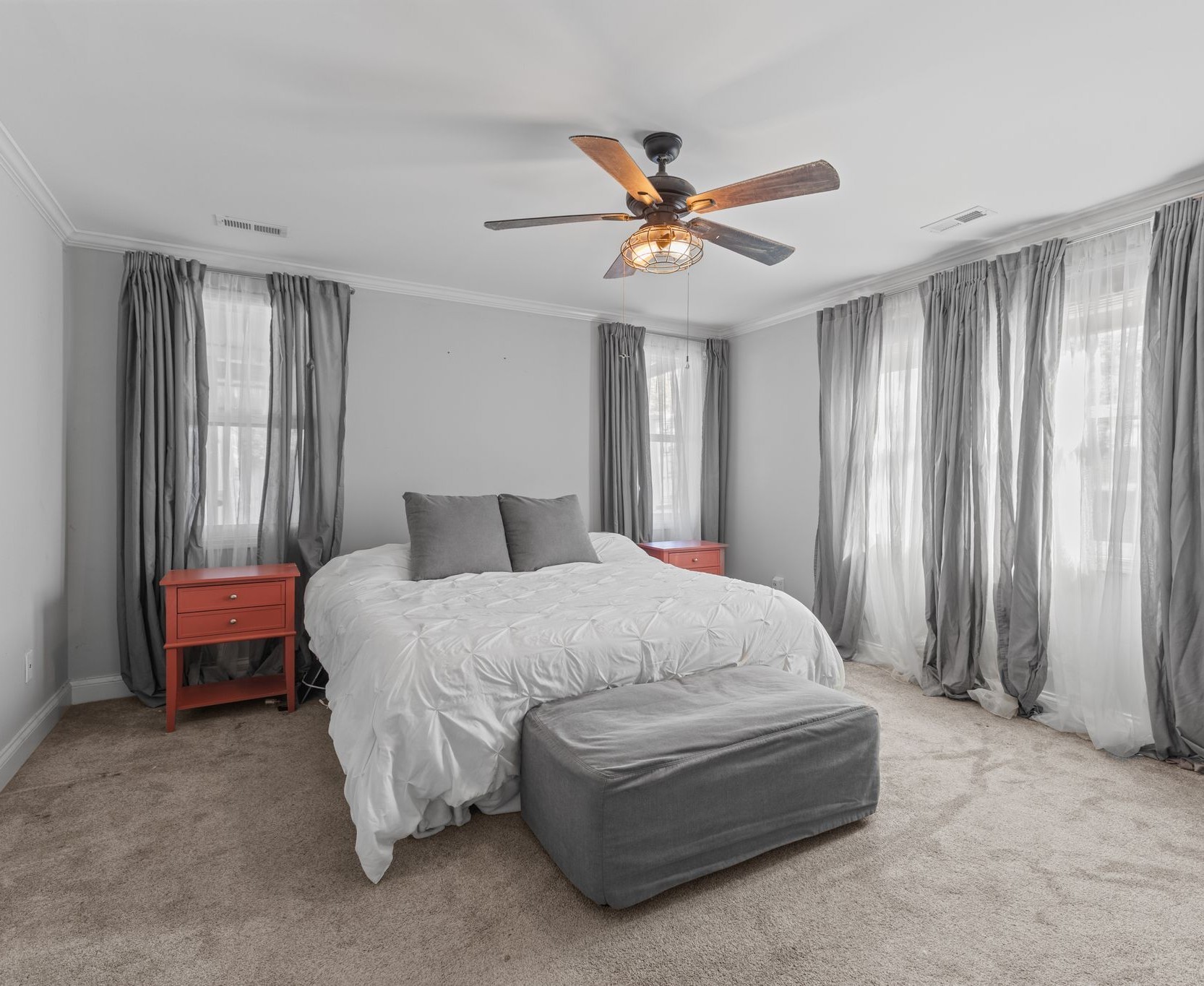 10209 New Hope Road Bon Aqua, TN 37025 - Photo 9 of 27 a spacious bedroom with a bed and a chandelier