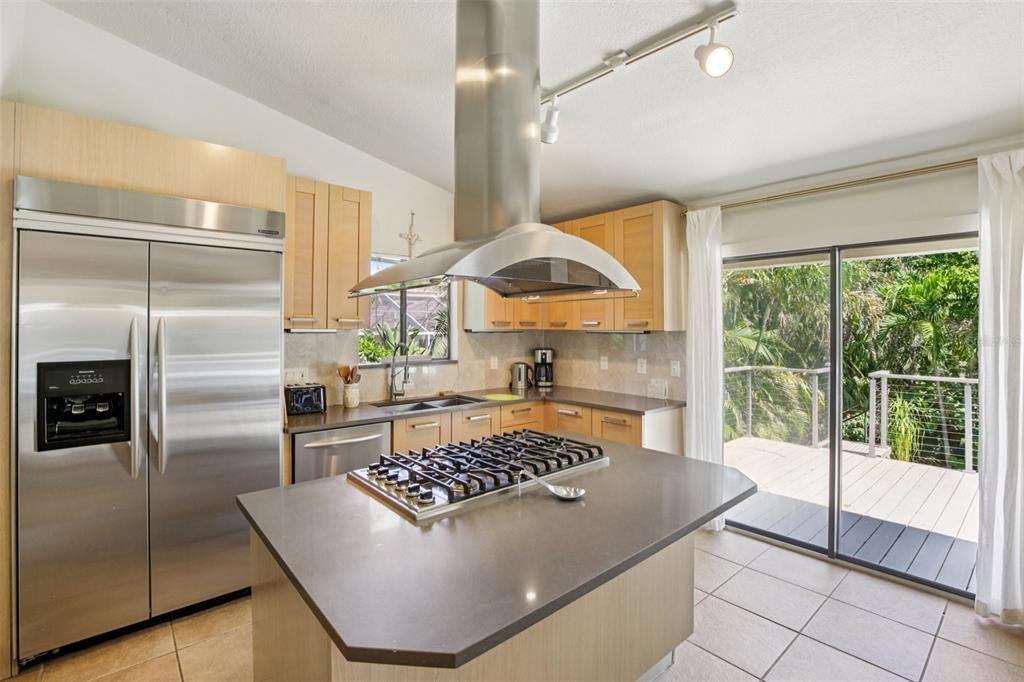 3390 Bayou Sound Longboat Key, FL 34228 - Photo 21 of 59 a kitchen with a stove a refrigerator and a sink