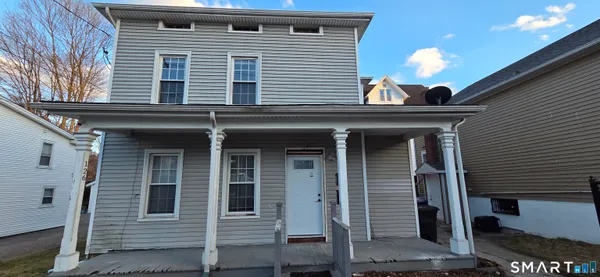a view of a house with a window and door