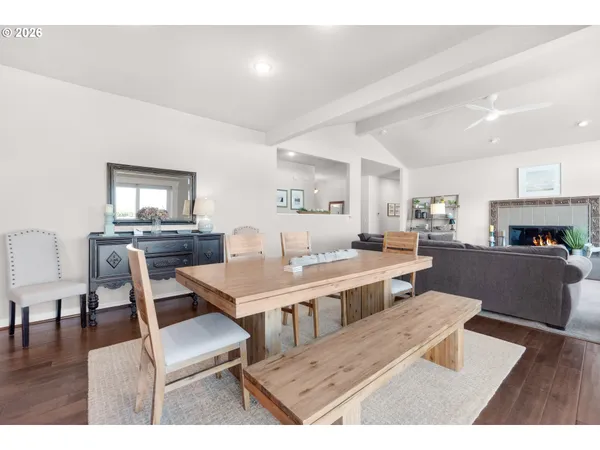 a living room with stainless steel appliances kitchen island granite countertop furniture and a kitchen view