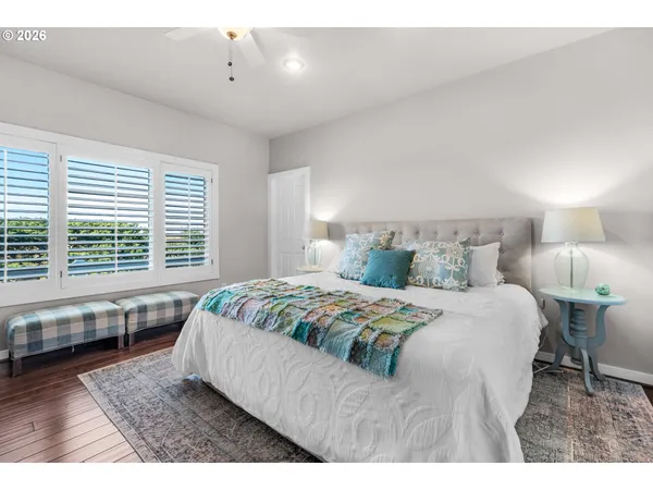 a bedroom with a large bed and a window