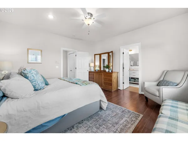 a bedroom with a large bed and furniture