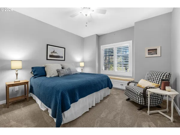 a bedroom with a bed and a couch