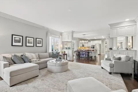 a kitchen with kitchen island a refrigerator stove microwave and cabinets