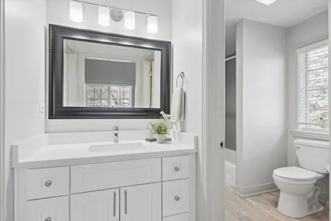 a bedroom with bed and window