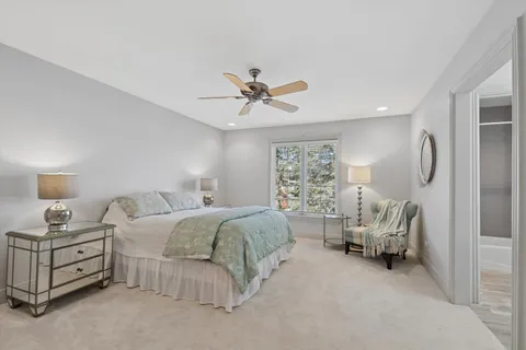 a bathroom with a toilet a sink and bathtub