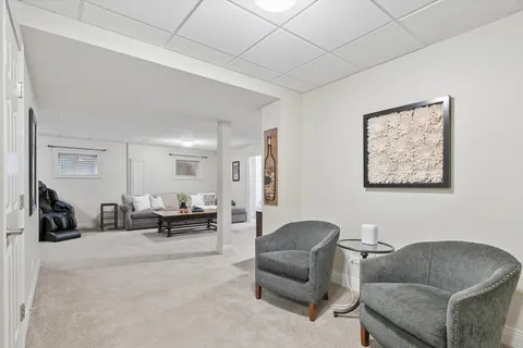 a bathroom with a sink toilet and mirror