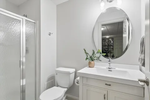a view of a chairs and table in backyard of the house