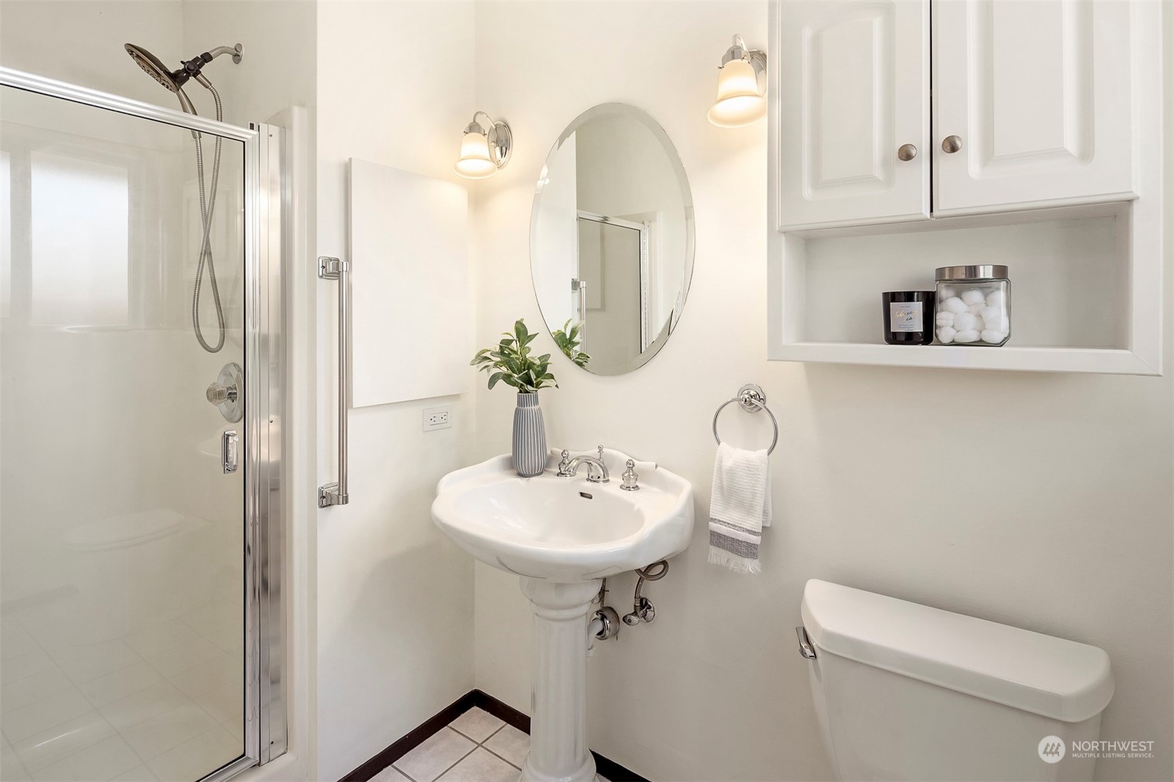 3226 60th Avenue Southwest Seattle, WA 98116 - Photo 12 of 34 a bathroom with a toilet sink and mirror