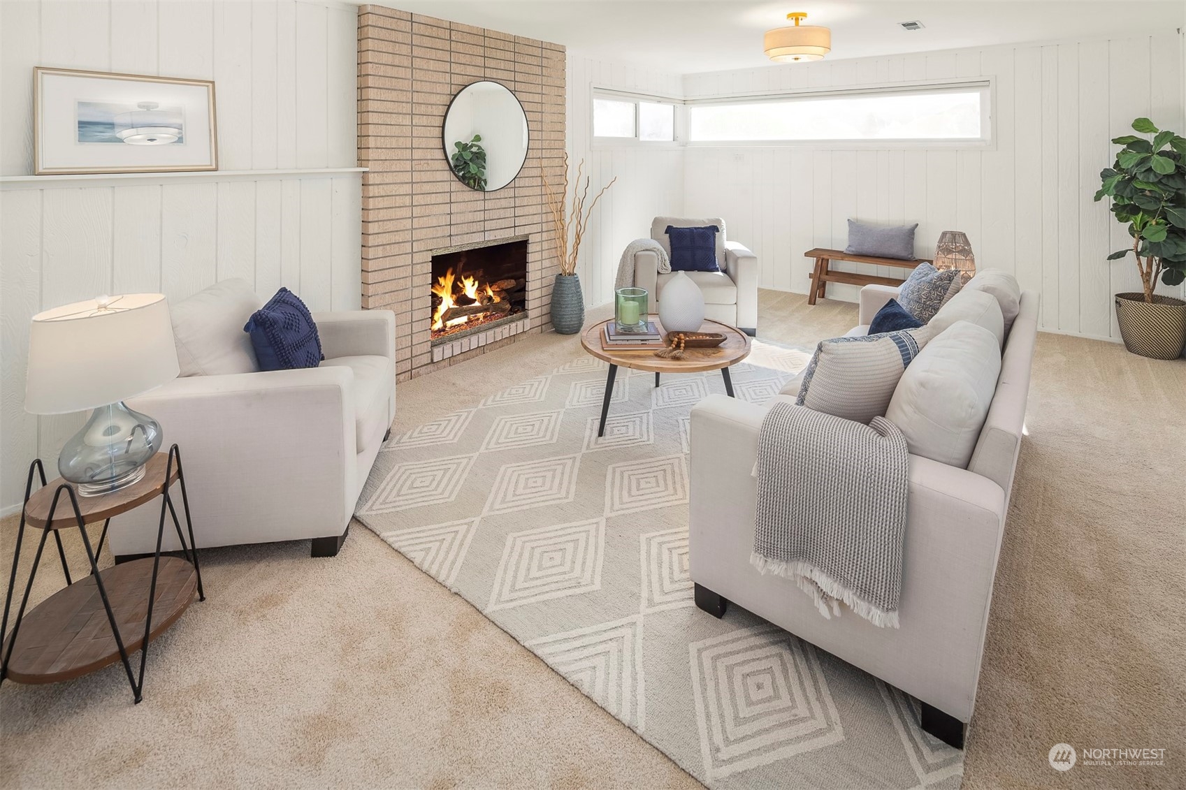 3226 60th Avenue Southwest Seattle, WA 98116 - Photo 15 of 34 a living room with furniture a fireplace and a potted plant