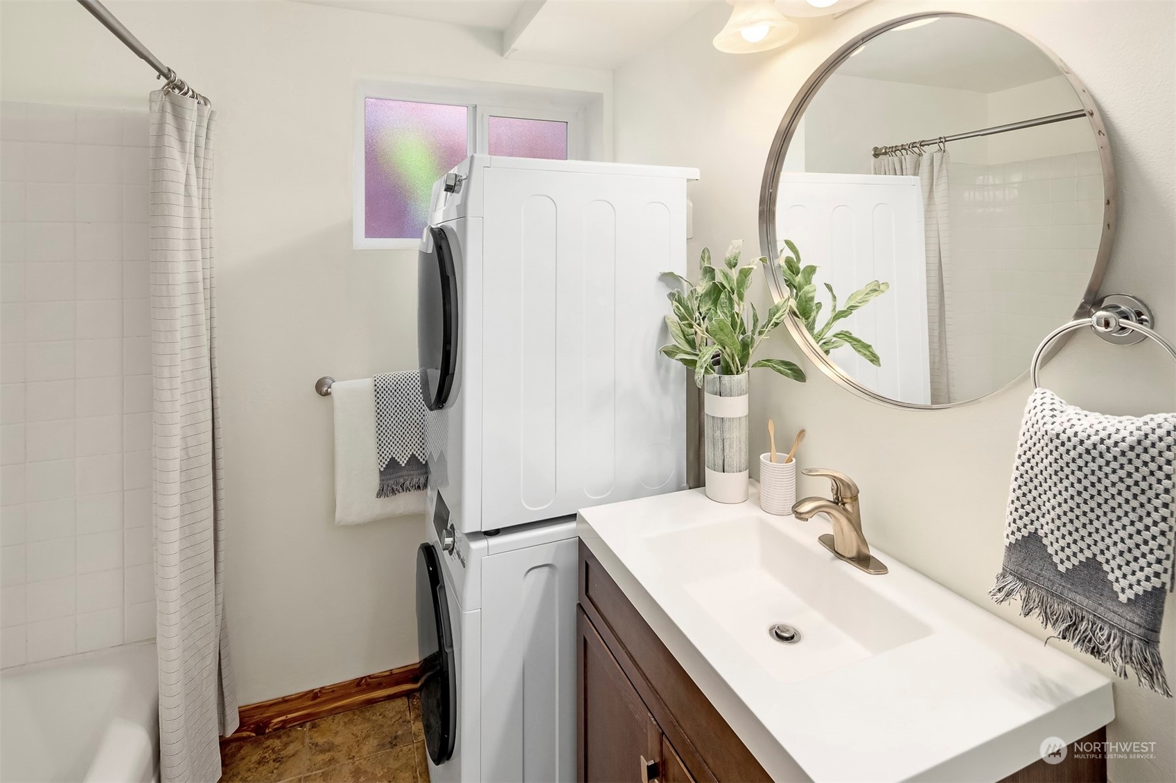 3226 60th Avenue Southwest Seattle, WA 98116 - Photo 23 of 34 a bathroom with a sink mirror and shower