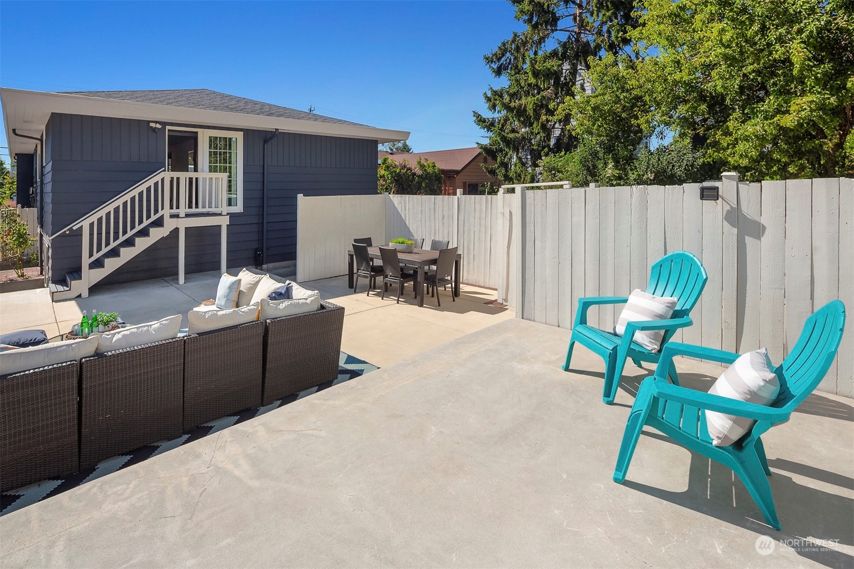 3226 60th Avenue Southwest Seattle, WA 98116 - Photo 25 of 34 a view of a chairs and tables in the back yard of the house
