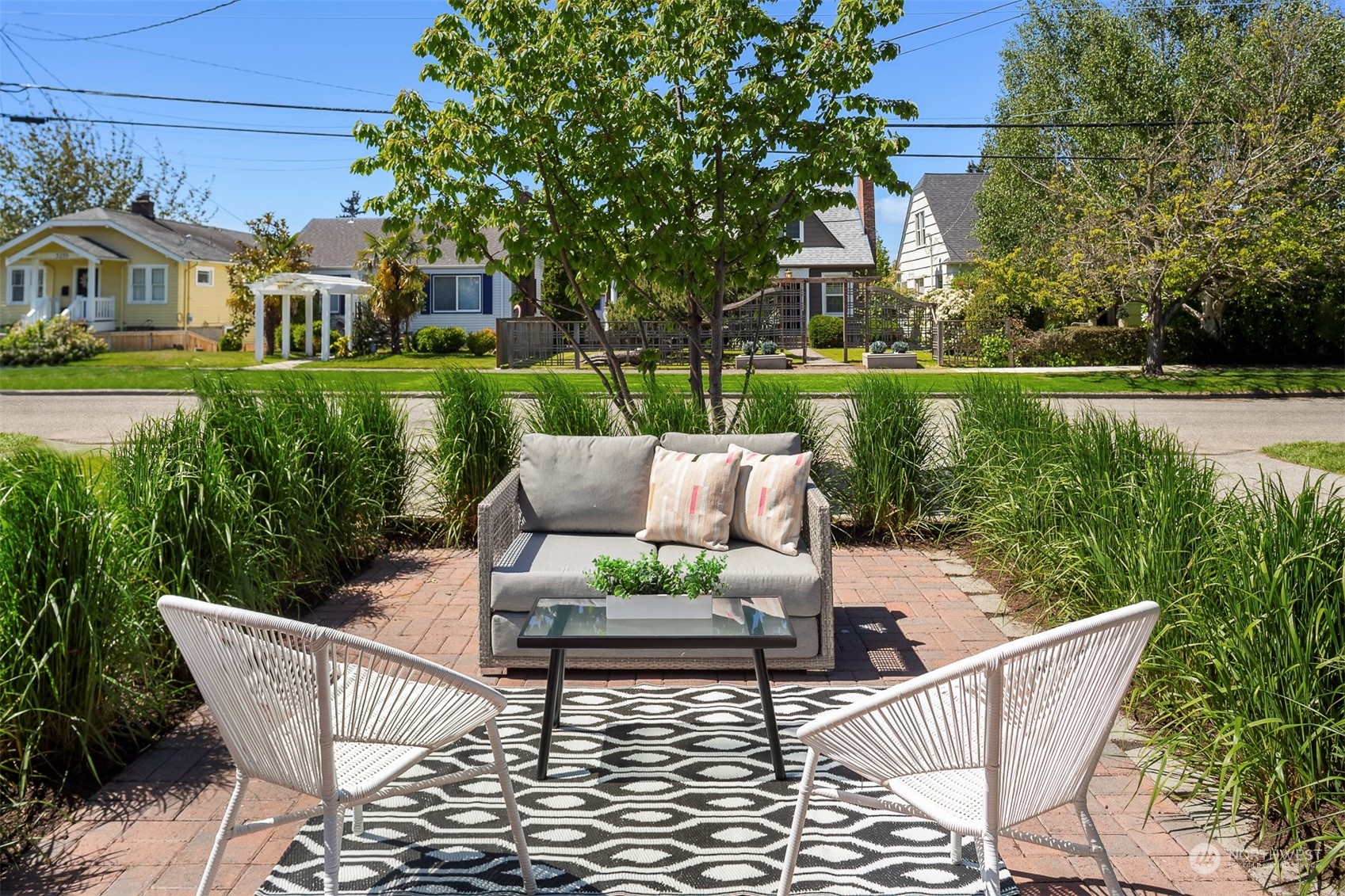 3226 60th Avenue Southwest Seattle, WA 98116 - Photo 3 of 34 a view of a patio with couches chairs and a yard