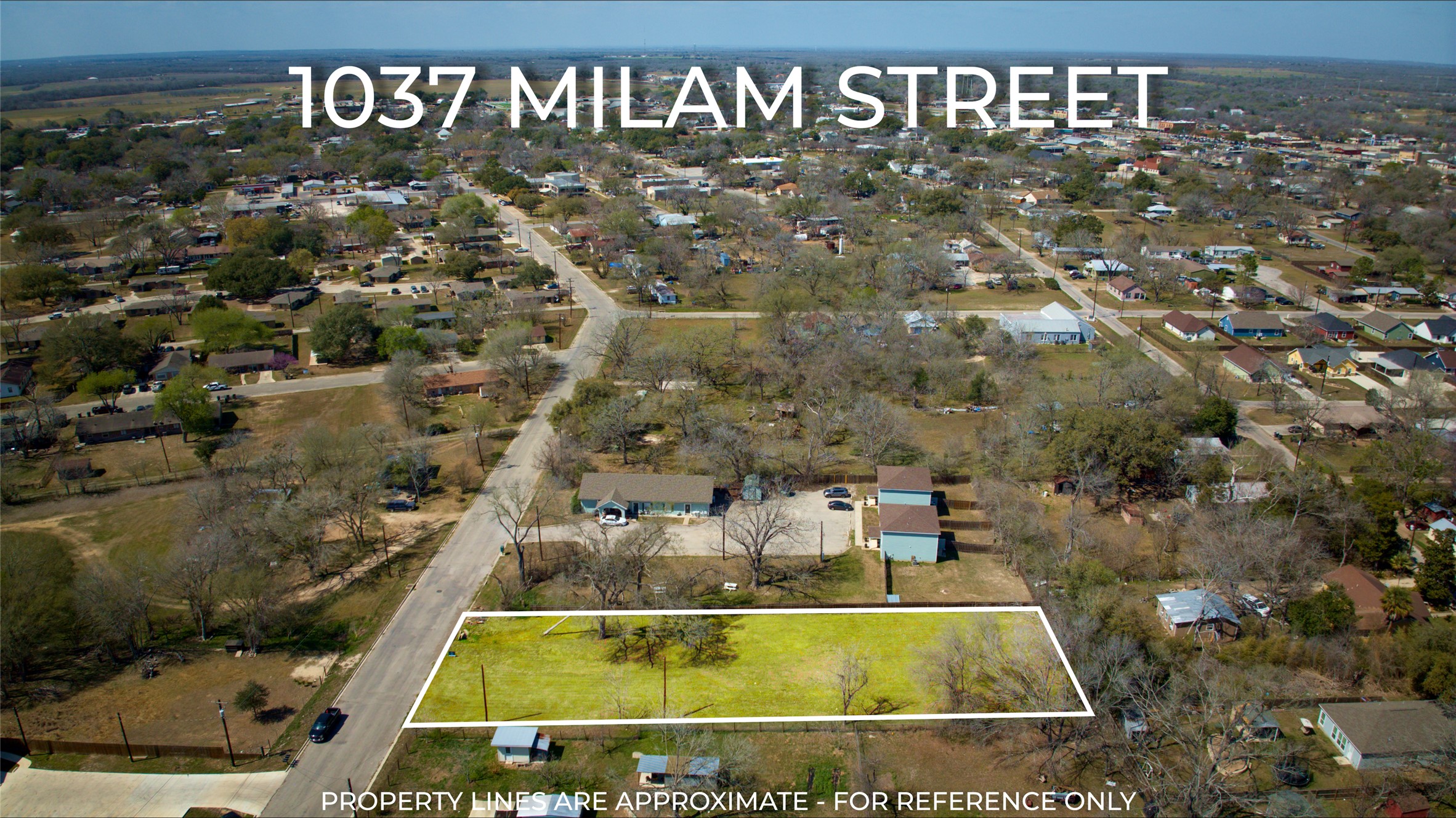 1037 East Milam Street Luling, TX 78648 - Photo 12 of 17 Aerial view of property and surrounding area with property parcel outlined