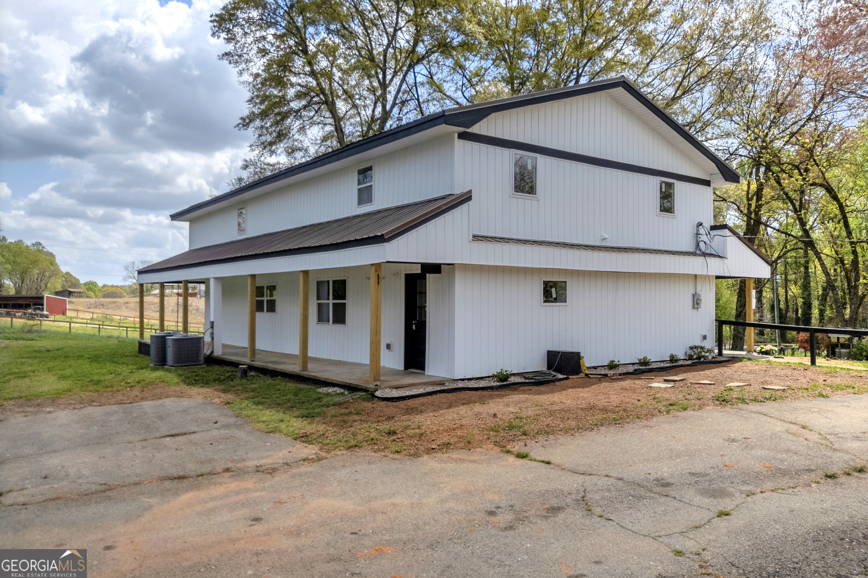 8606 Holly Springs Road Maysville, GA 30558 - Photo 16 of 74 a view of a house with a yard