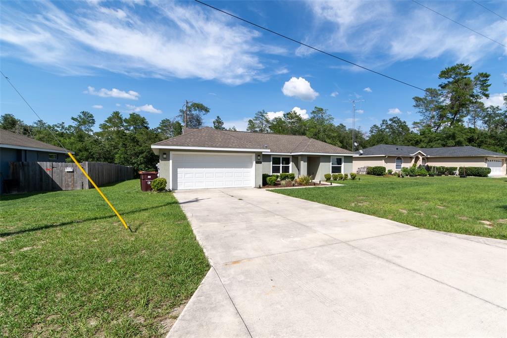 5107 Southwest 165th St Road Ocala, FL 34473 - Photo 29 of 34 a view of house with a yard