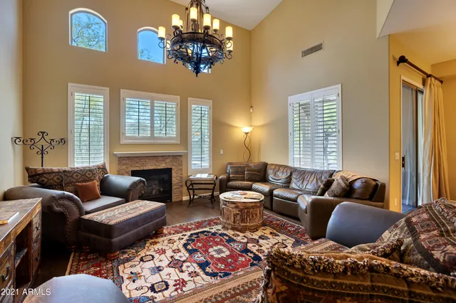 a bedroom with bed and glass door