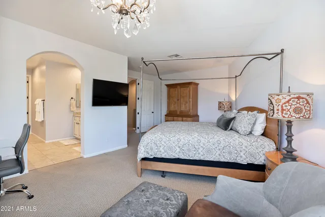 a bathroom with a granite countertop sink mirror and shower