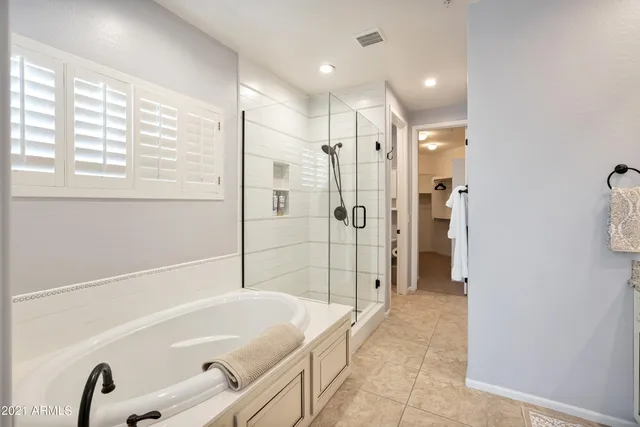a bathroom with a bathtub and shower