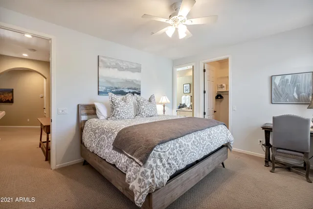 a view of a swimming pool with a patio and a garden
