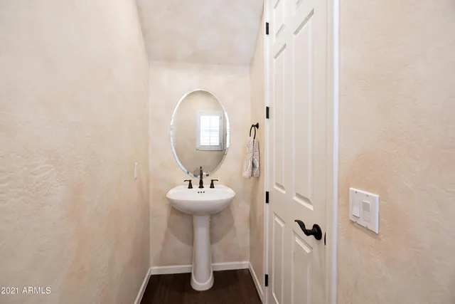 a view of a bathroom with a sink and mirror