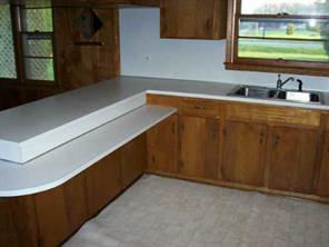 525 Murdock Road Troutman, NC 28166 - Photo 2 of 5 a kitchen with a sink and a window