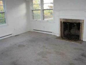 525 Murdock Road Troutman, NC 28166 - Photo 5 of 5 an empty room with windows and fireplace
