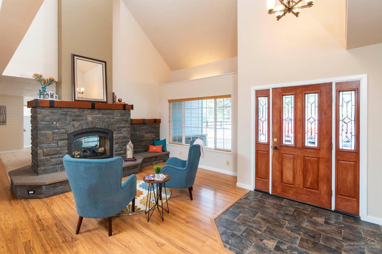60098 Cinder Butte Road Bend, OR 97702 - Photo 2 of 25 a living room with furniture and a fireplace