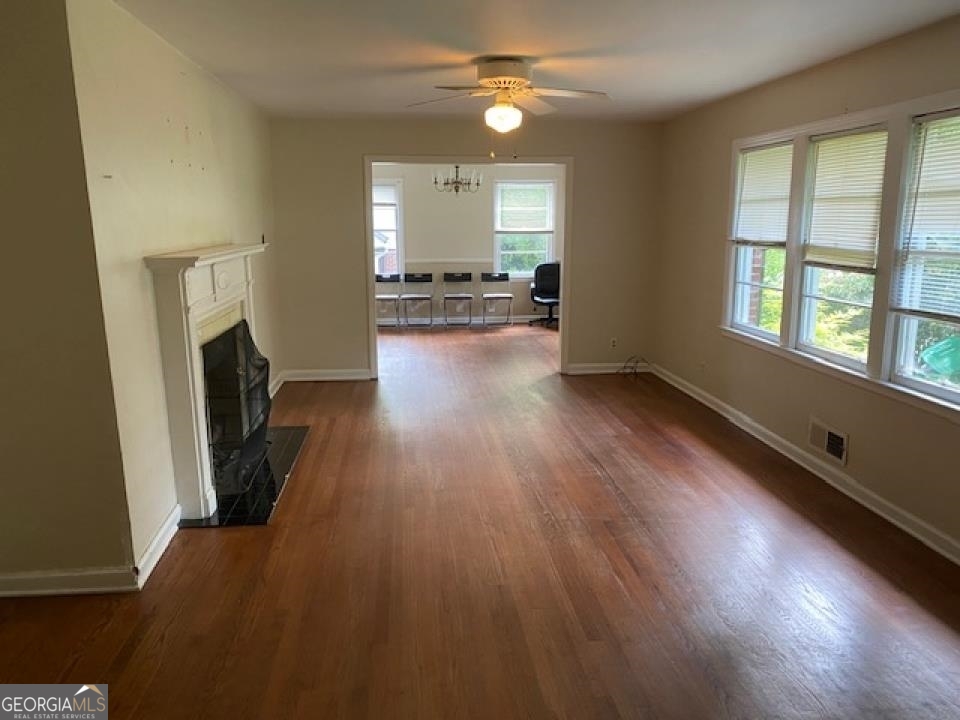 1193 Clifton Road Atlanta, GA 30307 - Photo 23 of 31 wooden floor in an empty room with a window