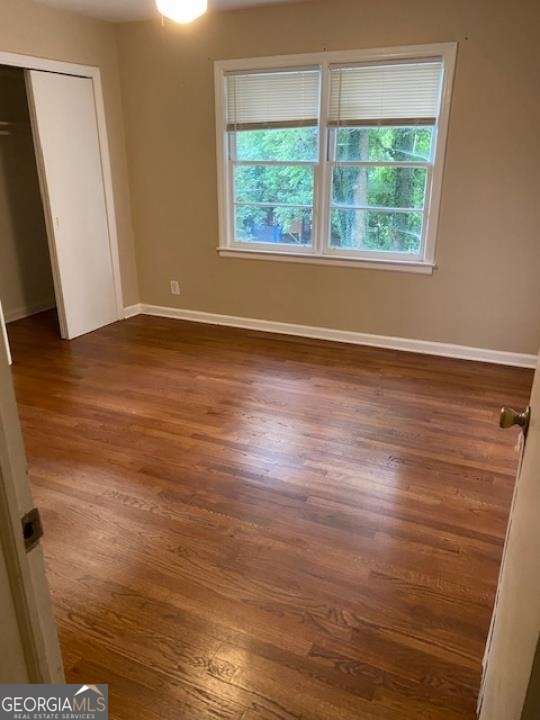 1193 Clifton Road Atlanta, GA 30307 - Photo 24 of 31 an empty room with wooden floor and windows