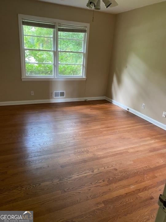 1193 Clifton Road Atlanta, GA 30307 - Photo 28 of 31 an empty room with wooden floor and windows