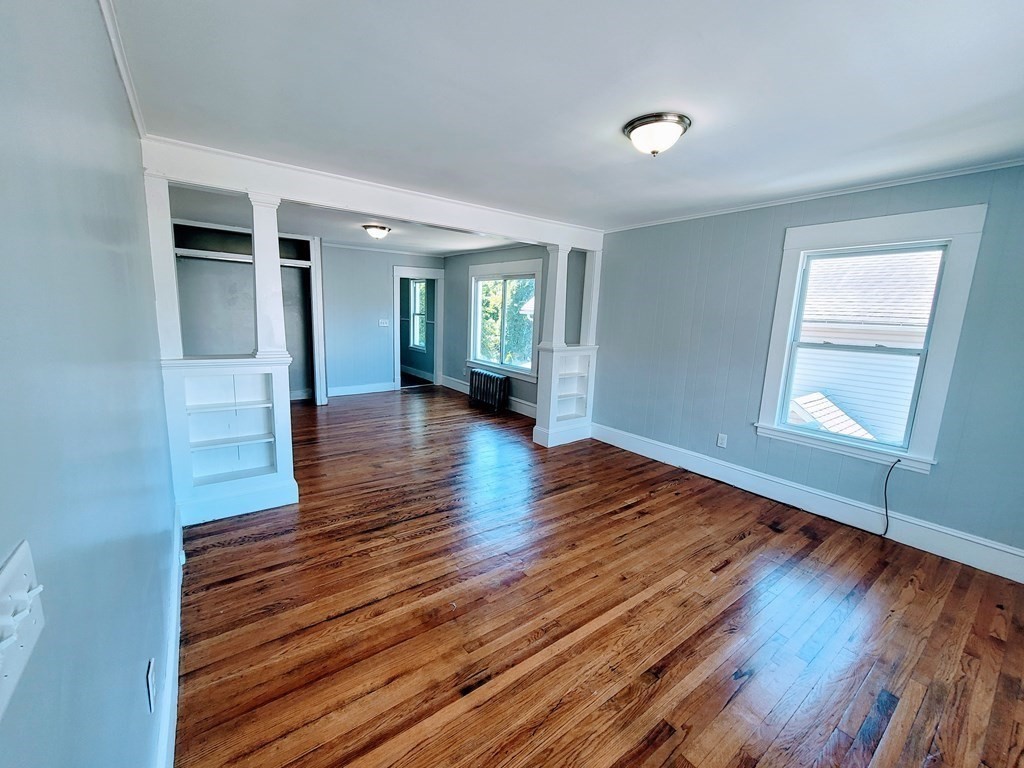 33-35 Algonquin Place Springfield, MA 01104 - Photo 4 of 10 wooden floor in an empty room with a window