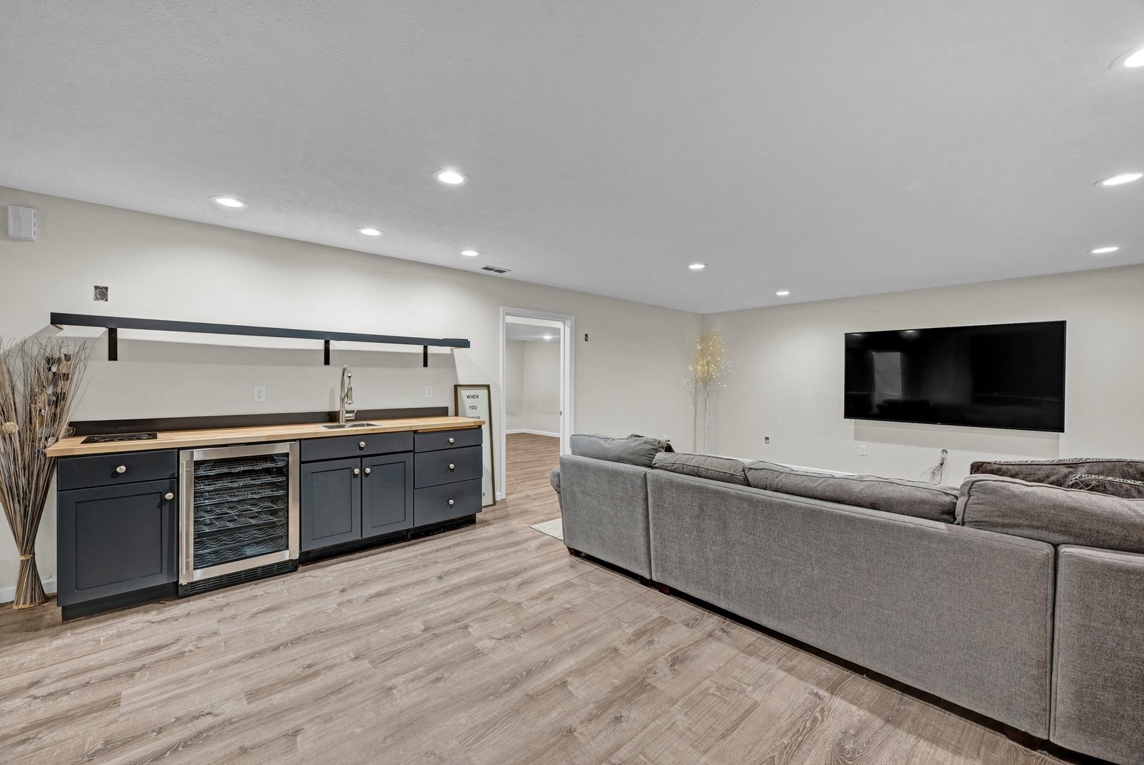 277 Cassidy Road Normal, IL 61761 - Photo 23 of 42 a large living room with stainless steel appliances kitchen island granite countertop a large window and a couch