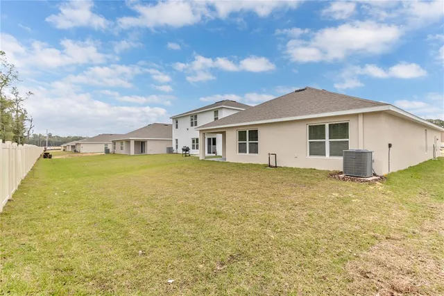 a view of a house with a yard and garage