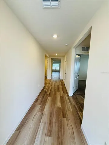 a view of a bathroom with wooden floor