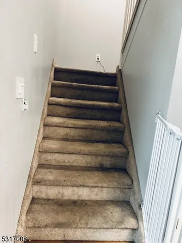 a view of a bathroom with a toilet and a shower curtain