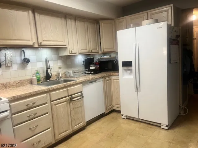 a view of a livingroom with balcony and furniture