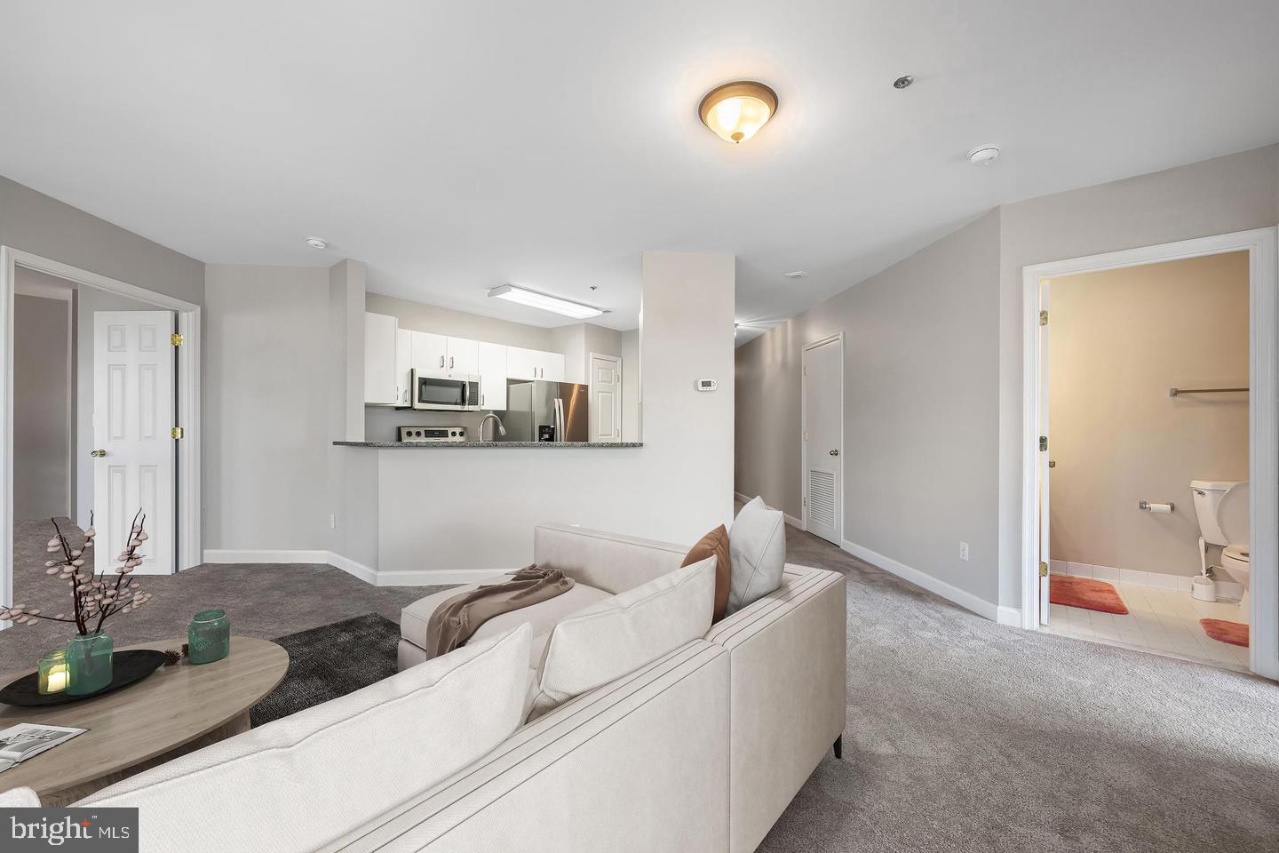 100 Harborview Drive, Unit 212 Baltimore, MD 21230 - Photo 11 of 29 a living room with furniture and view of kitchen